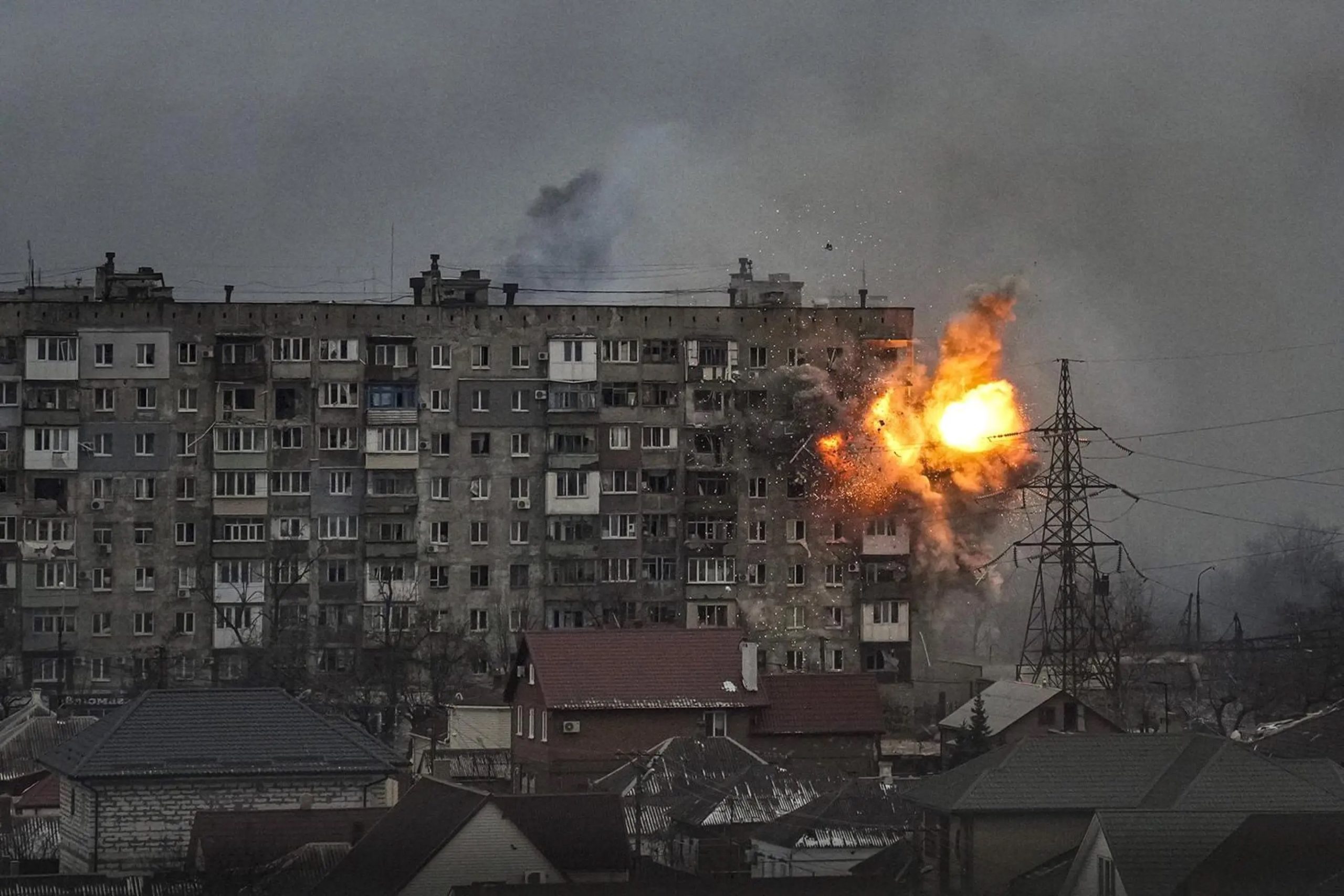 An apartment building explodes after Russian army tank fire in Mariupol, Ukraine, March 11, 2022. (AP Photo/Evgeniy Maloletka)