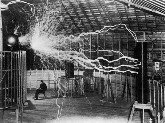 Nikola Tesla, with his equipment